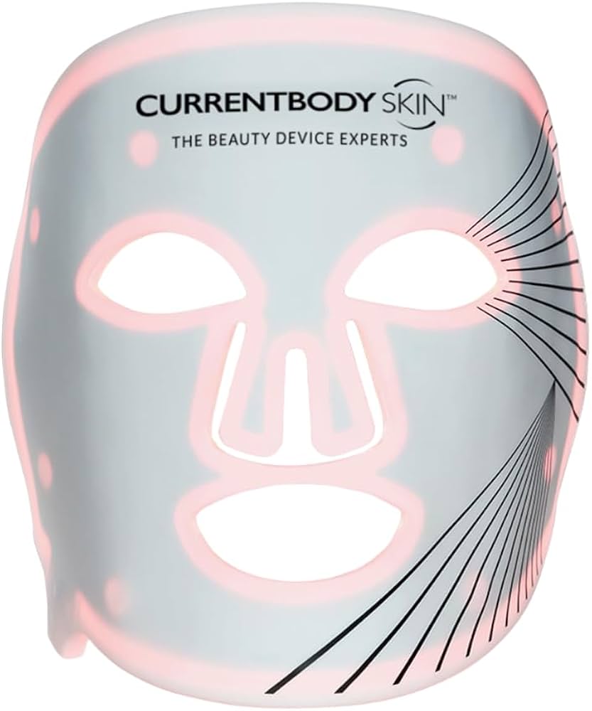 White CurrentBody Skin LED Light Therapy Facial Mask glowing with pink lights, showing brand logo.