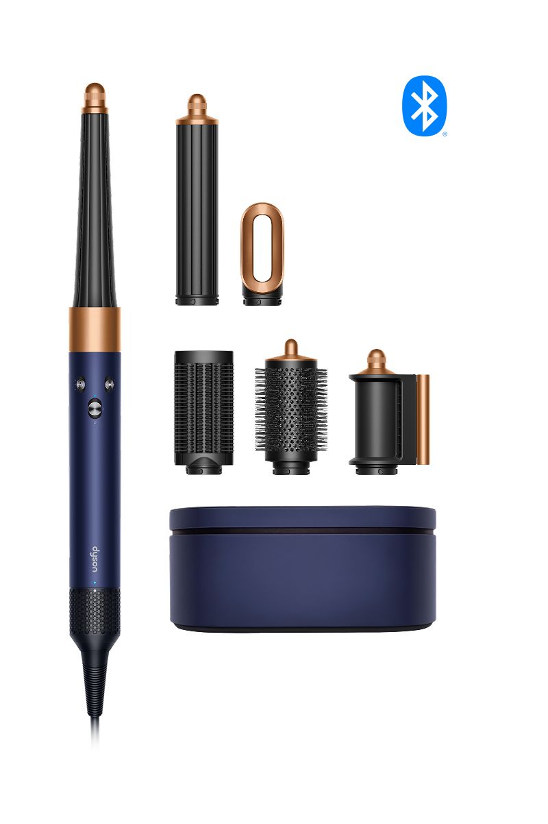 Dyson Airwrap multi-styler complete set in Prussian Blue and Copper with attachments, case, and Bluetooth logo.