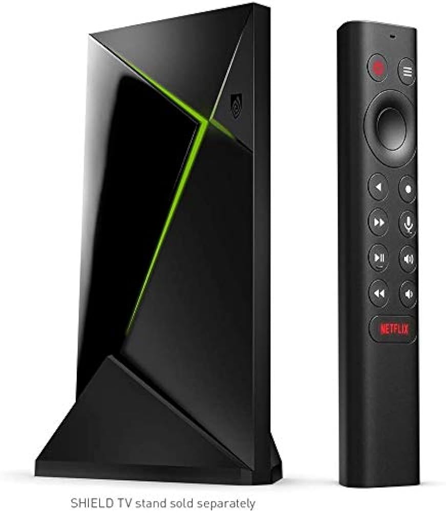 NVIDIA Shield TV Pro streaming device (black with green light) and its black remote control.