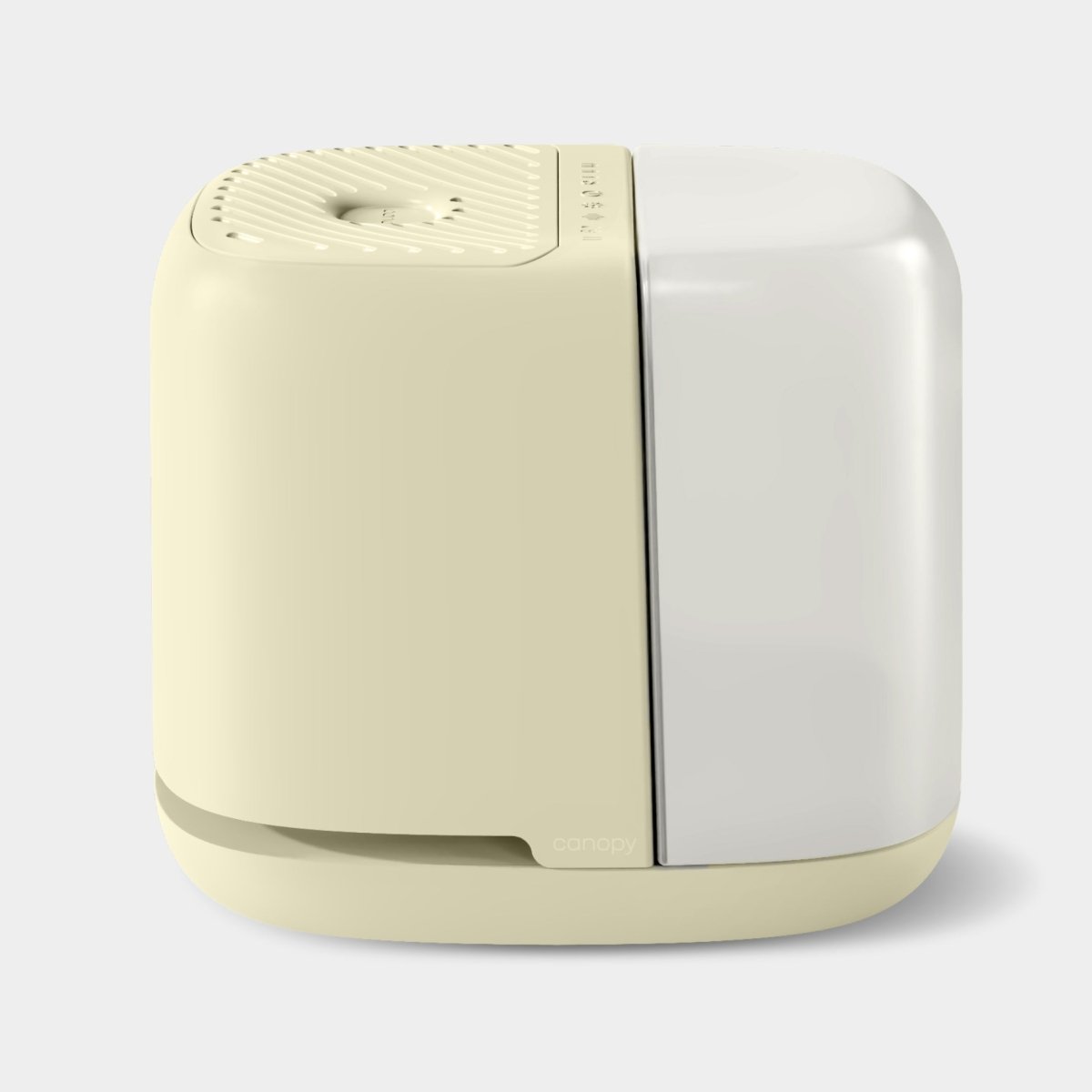 A modern cream and white Canopy bedside humidifier with a minimalist design.