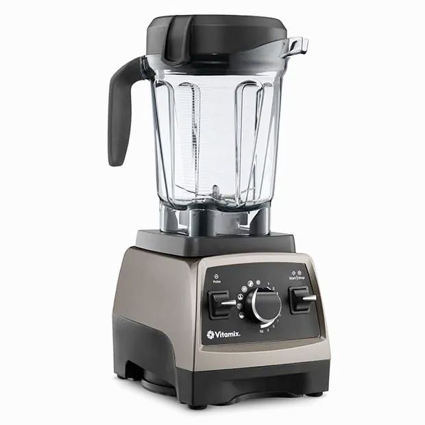 Vitamix Pro 750 blender featuring a clear pitcher, black lid, and control panel with speed dial and lever switches.